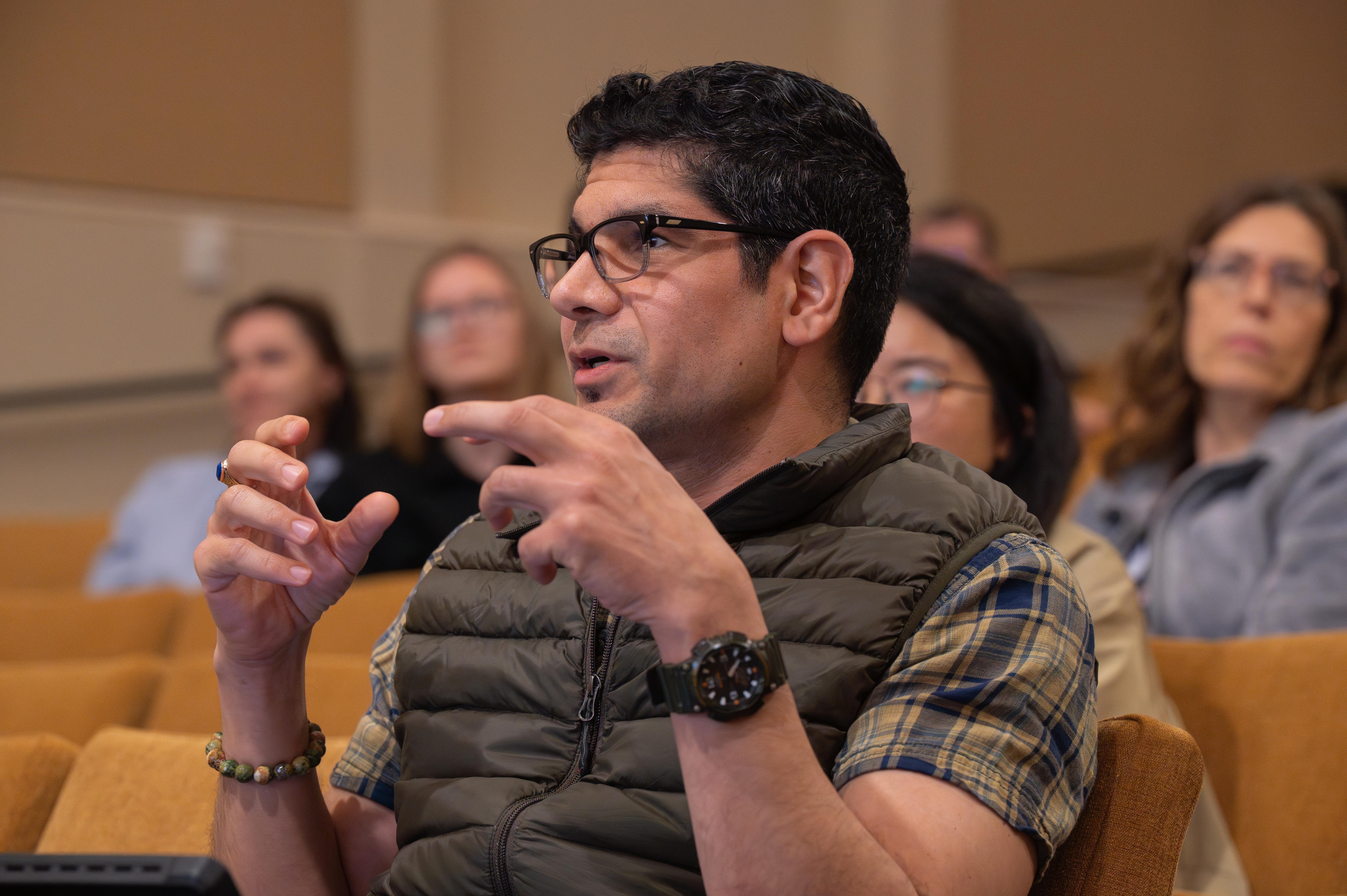 A member of the audience asks a question during Frontiers in Science.