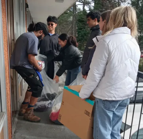 Club members spend a Saturday distributing clothes to those in need.