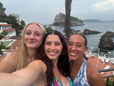 Students from Psychology 3000, including Abby Davis, Bailey Benak, and Sarah Peach took their studies global this summer, exploring how culture shapes stress and well-being — one breathtaking view at a time.