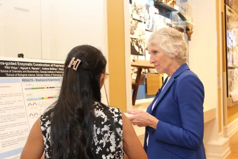 Graduate student Fnu Vidya (Chemistry and Biochemistry) discusses her research with Dean of the College of Sciences Susan Lozier.