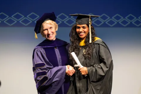 Dean Lozier congratulates a newly minted College of Sciences alum.