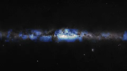 An artist’s composition of the Milky Way seen with a neutrino lens (blue). (IceCube Collaboration/U.S. National Science Foundation (Lily Le & Shawn Johnson)/ESO (S. Brunier))
