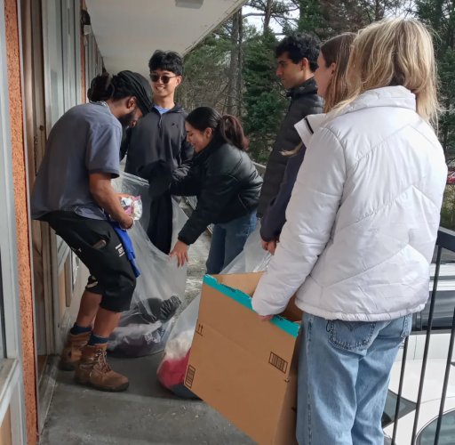 Club members spend a Saturday distributing clothes to those in need.