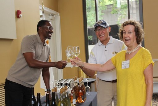 La Fête Wine Company Founder and CEO Donae Burston (Industrial Engineering 1998), Norman Chu (Electrical Engineering 1984), and Friends of Sciences Steering Committee Member Kathy Wilson-Chu raise a toast to Georgia Tech.